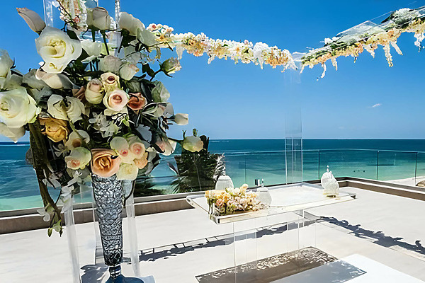 A wedding ceremony set up at Breathless Riviera Cancún Resort & Spa overlooking the ocean.