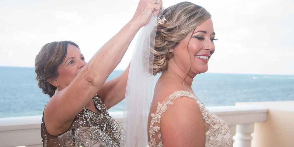 Bride gets her veil attached Erin and Travis destination wedding