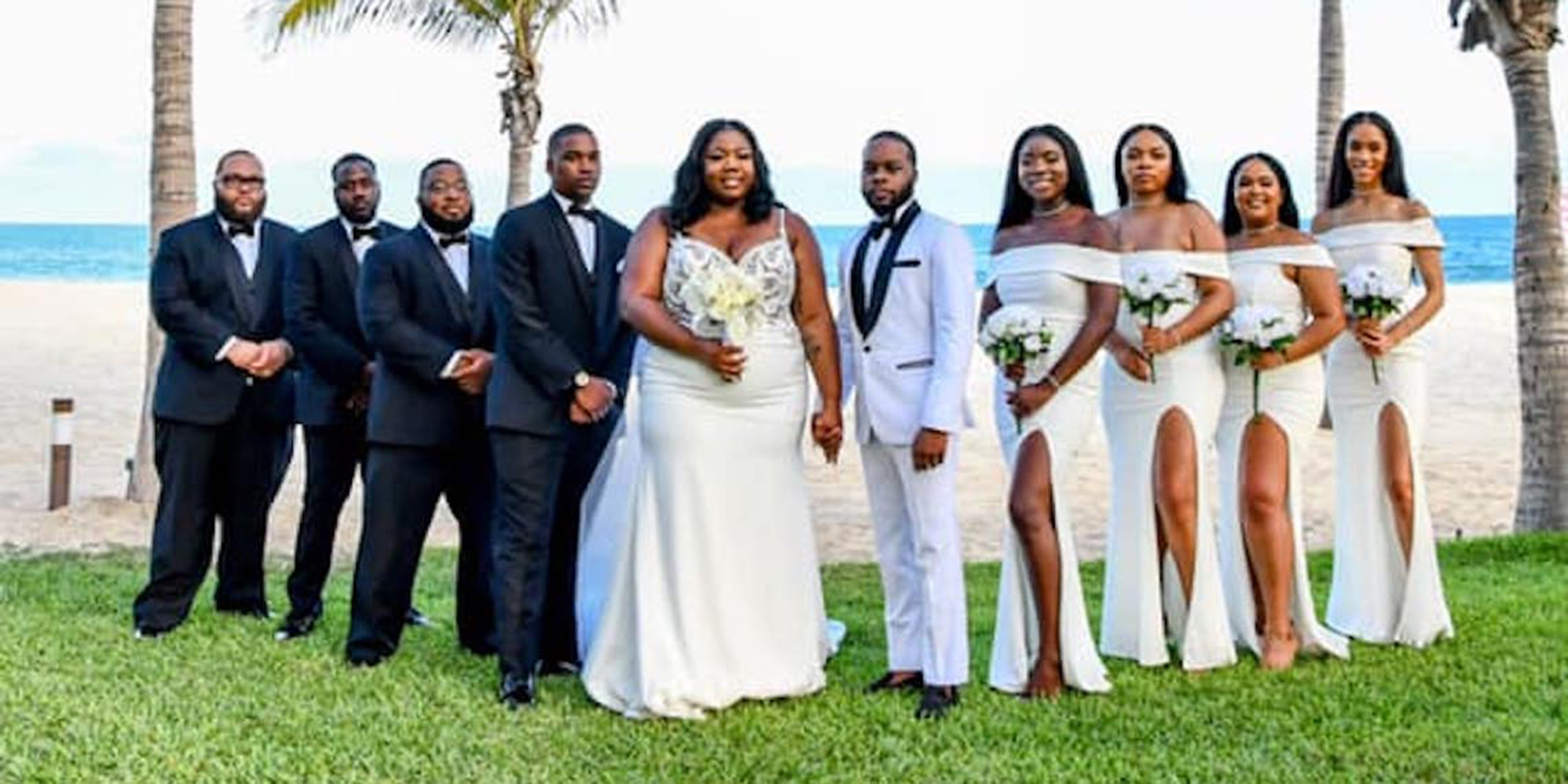 Imani and Walter pose with their wedding party bridesmaids and groomsmen