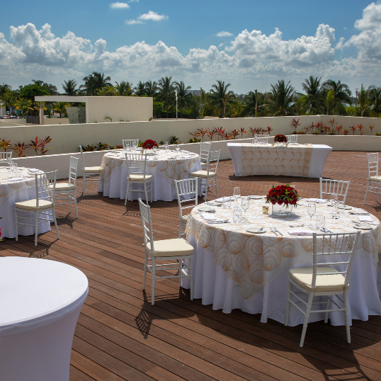 Rooftop destination wedding reception Royalton CHIC Suites Cancun - Beach sunset