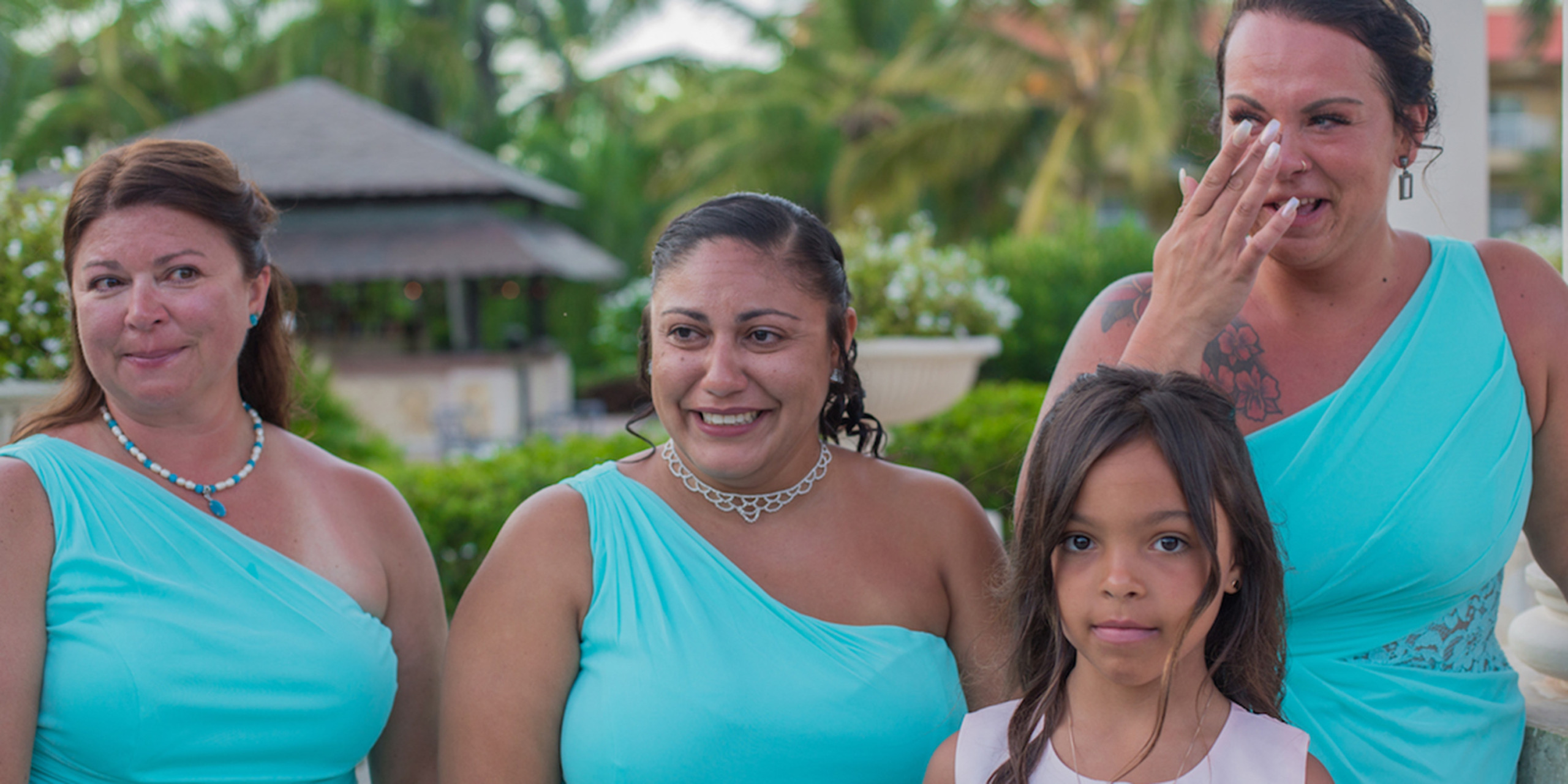 The bridesmaids and little girl cry during the wedding of Yolanda and Brett