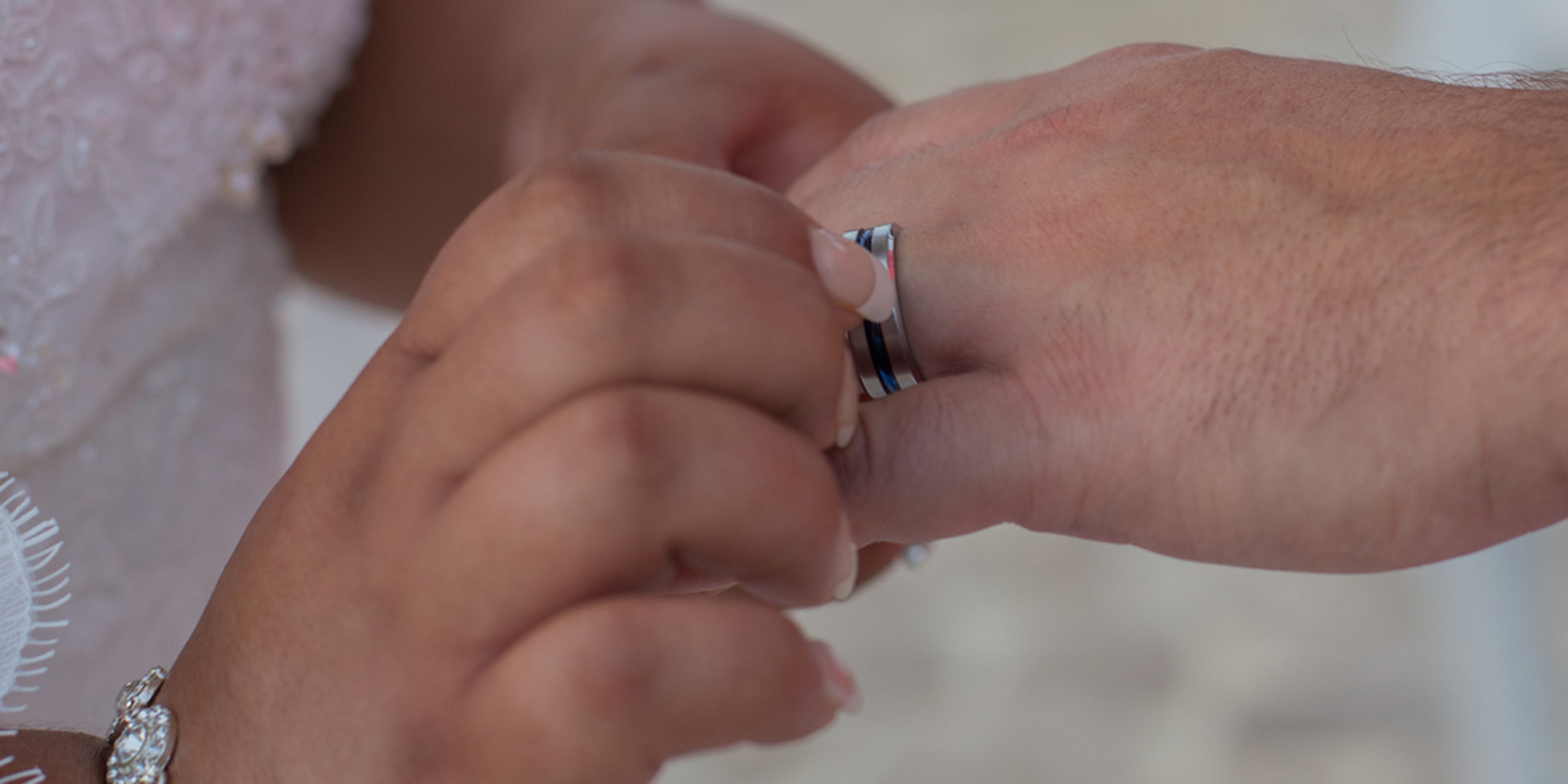 Yolanda puts Brett's wedding ring on his finger at the Yolanda and Brett destination wedding by Destify
