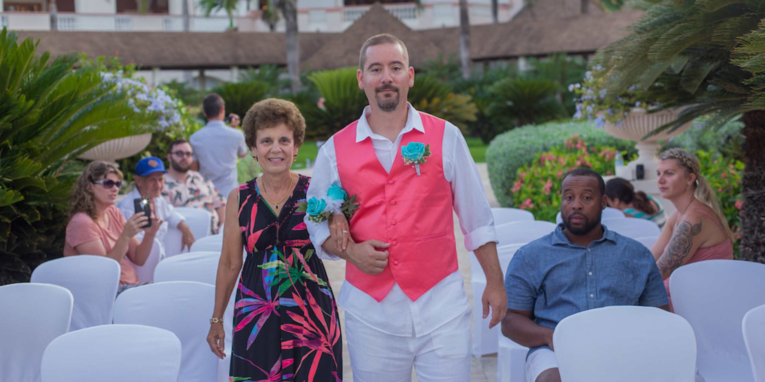 Brett walks down the aisle with his mom at the the Yolanda and Brett Destify destination wedding