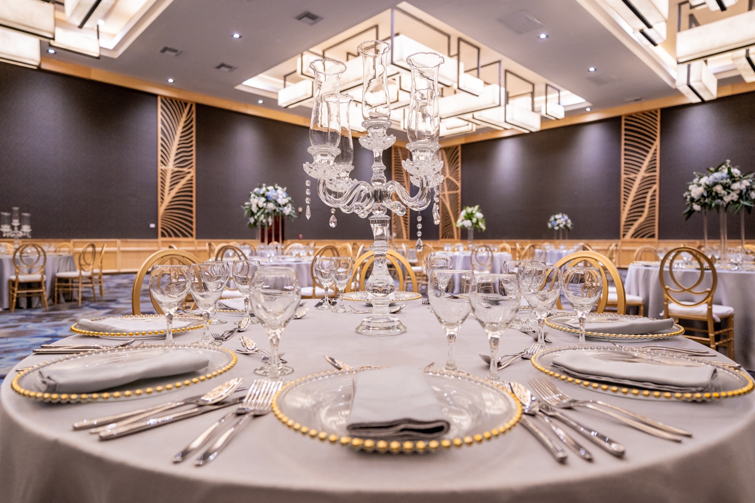 A banquet room set up for a Hilton La Romana (Adults Only) wedding reception.