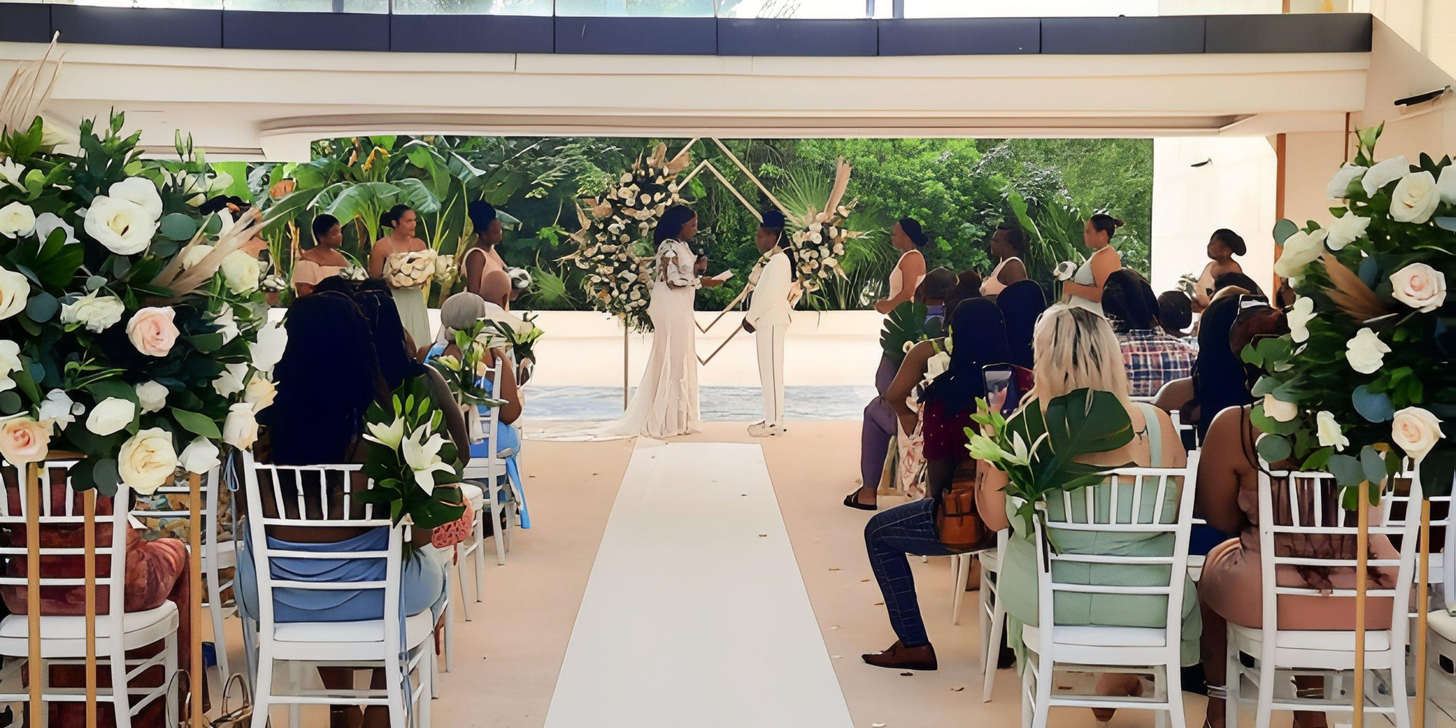A destination wedding at Haven Riviera Cancun, with guests seated on both sides of the wedding altar.