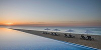 Infinity pool at Le Blanc Spa Resort Los Cabos, perfect for a destination wedding, with beach views.