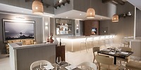 Le Blanc Spa Resort Los Cabos offers a stylish restaurant with neutral tones, ideal for destination weddings.