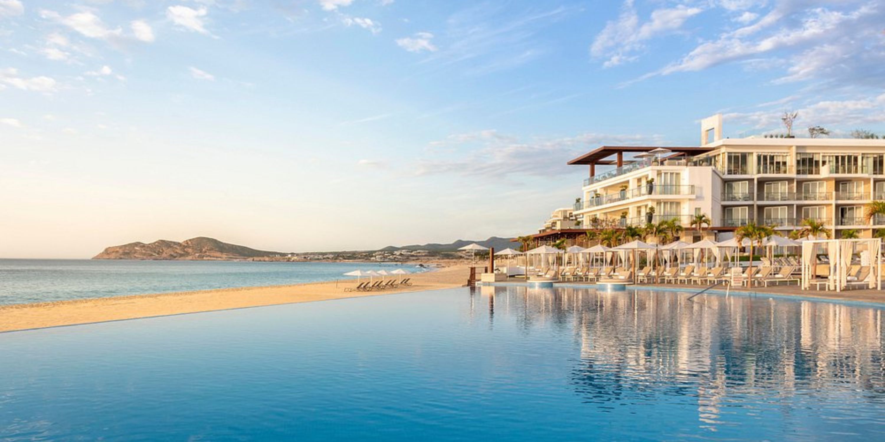 Le Blanc Spa Resort Los Cabos features an infinity pool with ocean views, perfect for a destination wedding.