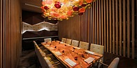 Le Blanc Spa Resort Los Cabos is a wedding destination with wood tables, chairs, and colorful lights.
