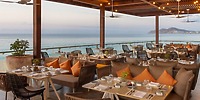 Le Blanc Spa Resort Los Cabos: destination wedding ocean-view dining with set tables and string lights.