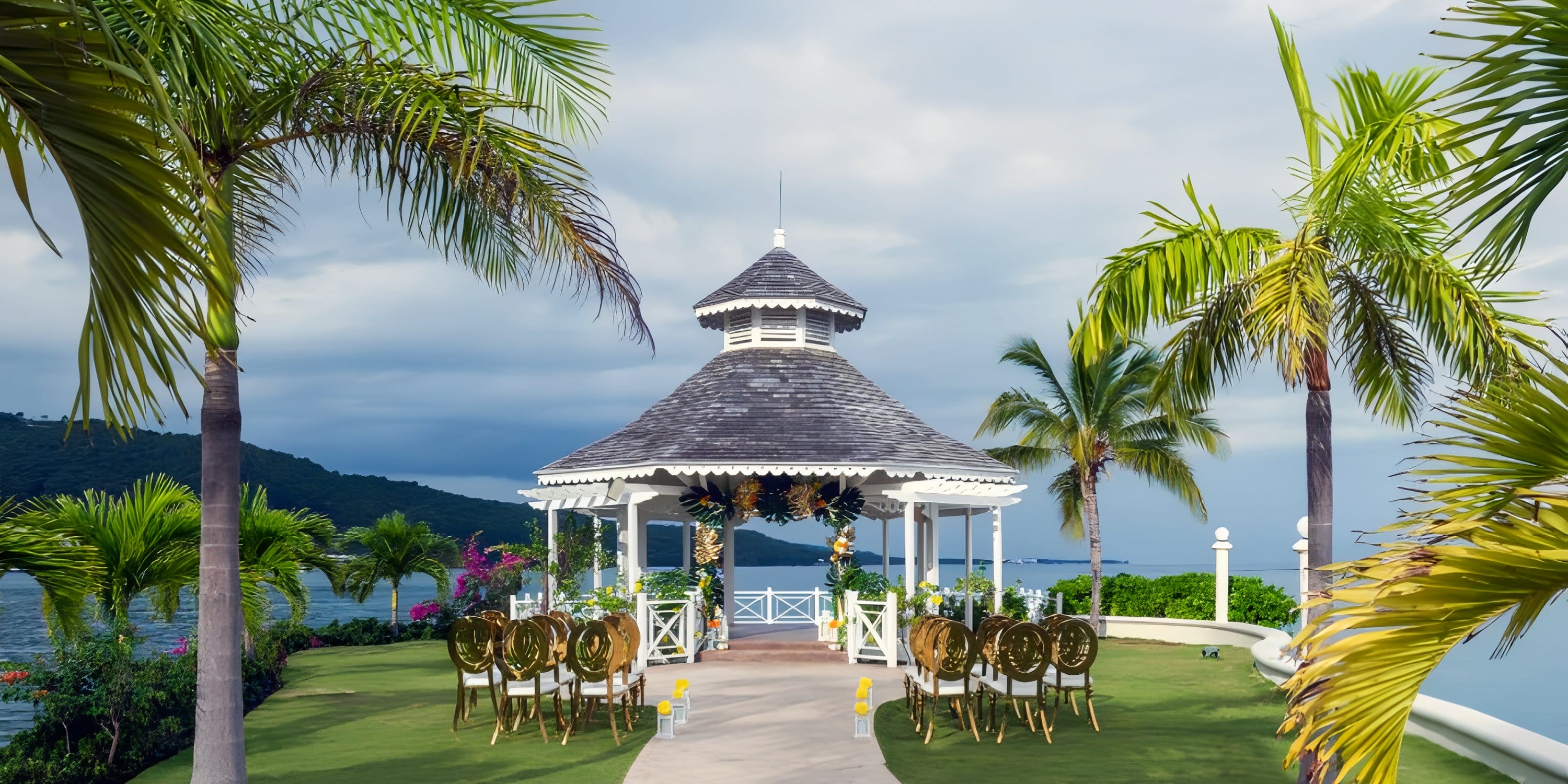 Moon Palace Jamaica gazebo set for a destination wedding, with chairs, palm trees, and ocean views.