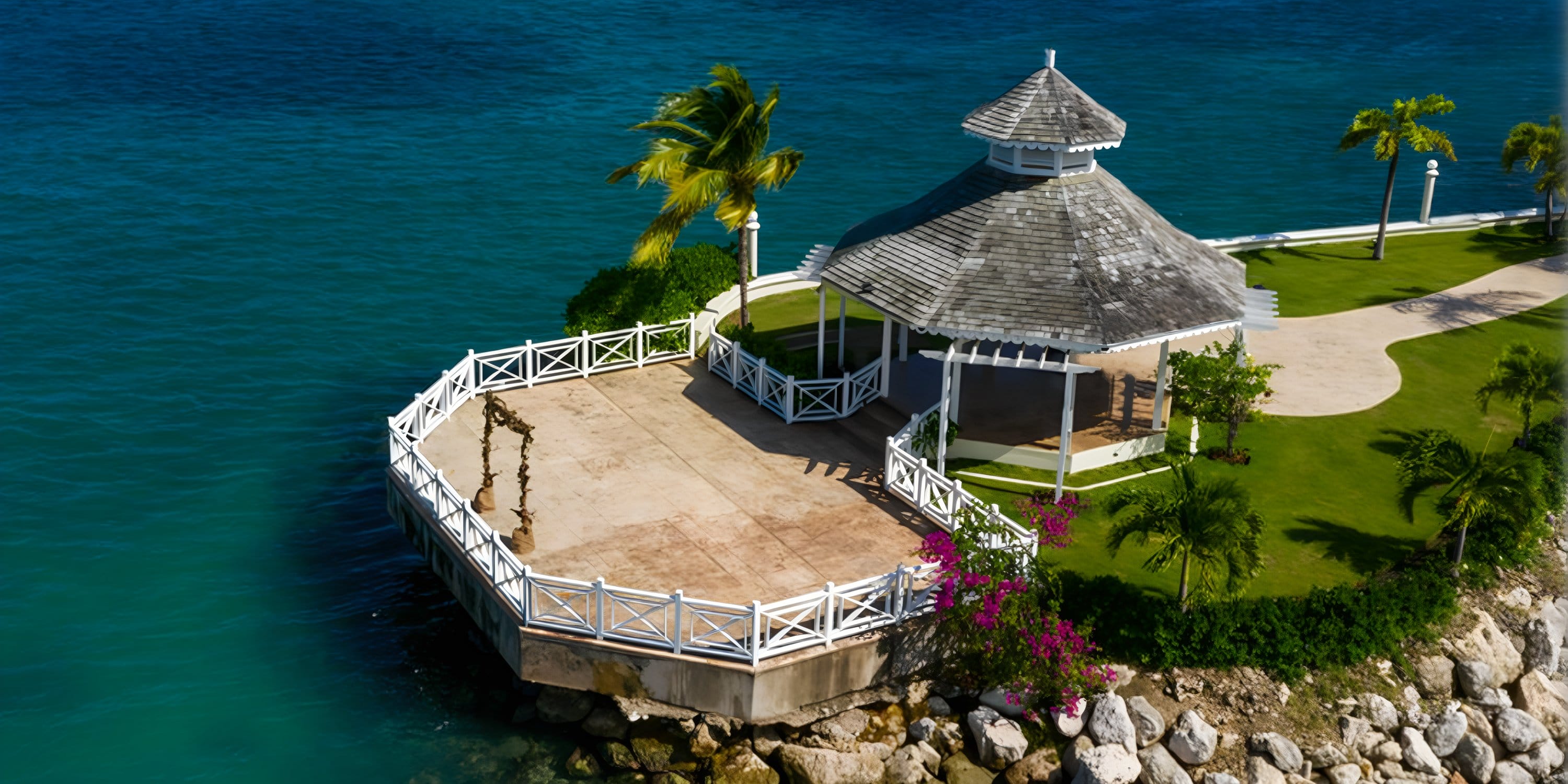 Moon Palace Jamaica: Ideal destination wedding spot with gray roof gazebo, ocean view, and palms.