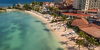 Aerial view of Moon Palace Jamaica, an idyllic destination wedding spot with white sand and turquoise water.
