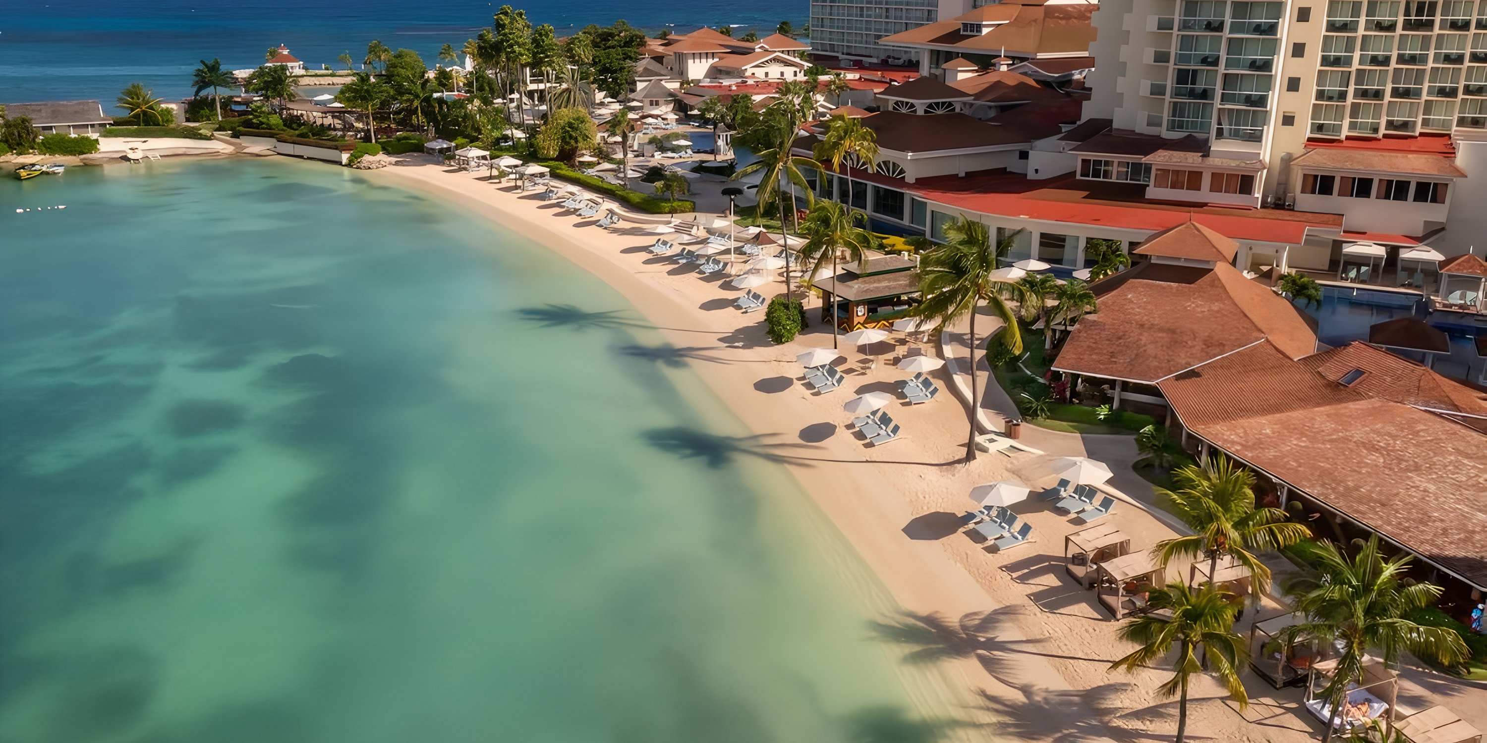 Aerial view of Moon Palace Jamaica, an idyllic destination wedding spot with white sand and turquoise water.