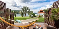 Unwind in a Moon Palace Jamaica hammock with pillow, ideal for a destination wedding by water and palms.