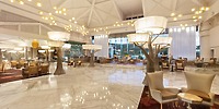 Elegant Moon Palace Jamaica lobby, ideal for destination wedding, features modern lighting and marble floors.