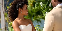 Bride in strapless white dress smiling with partner during their destination wedding at Moon Palace Jamaica.