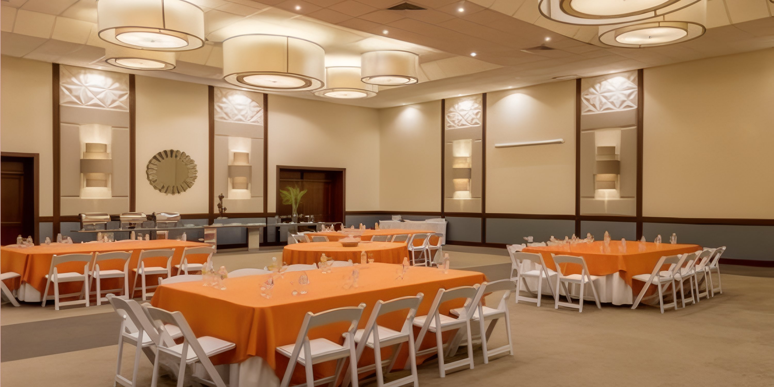 Ocean Blue and Sand banquet hall set for a destination wedding with orange tables, white chairs, modern lights.