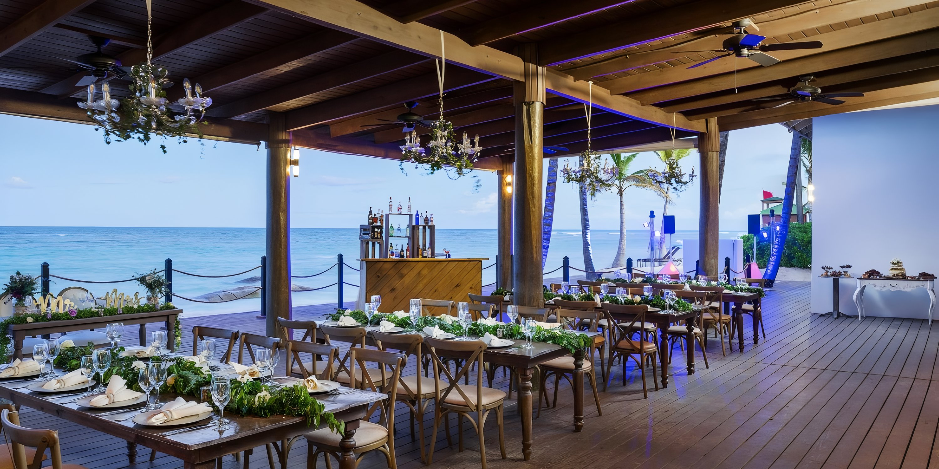 Ocean Blue and Sand provides seaside dining with decorated tables&mdash;perfect for a destination wedding view.