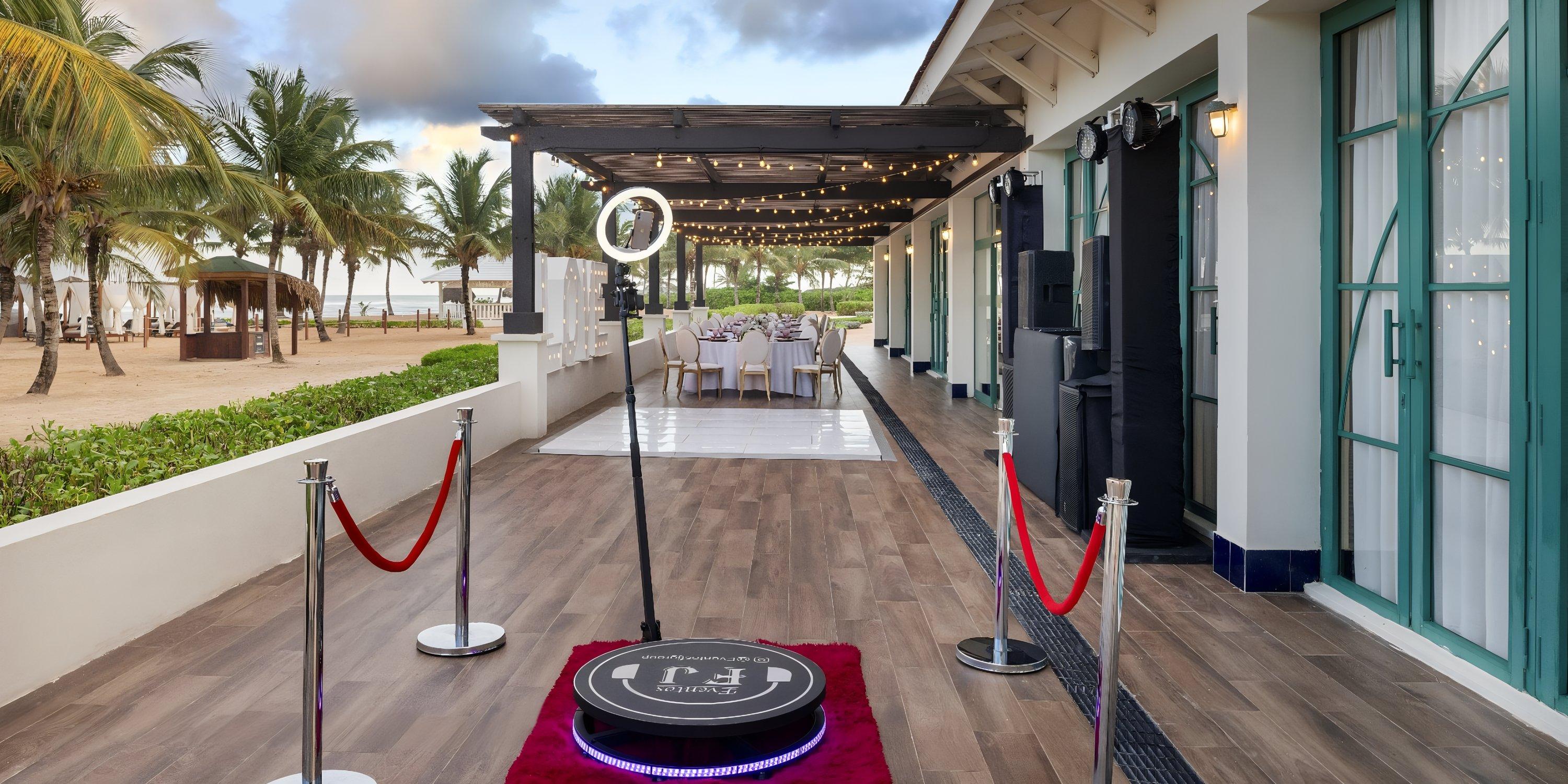 Ocean El Faro&rsquo;s photo booth, red ropes, and decorated tables create a dreamy destination wedding vibe.
