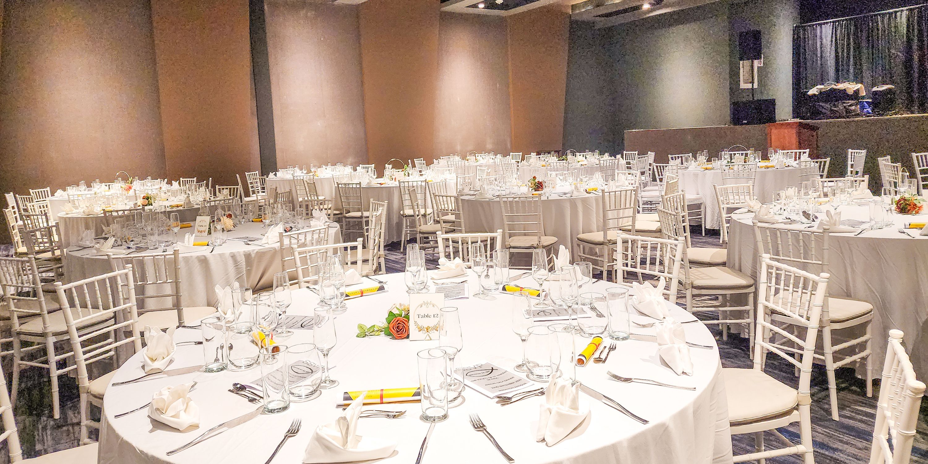 Royalton Antigua banquet hall set for a destination wedding, with round tables and white linens.