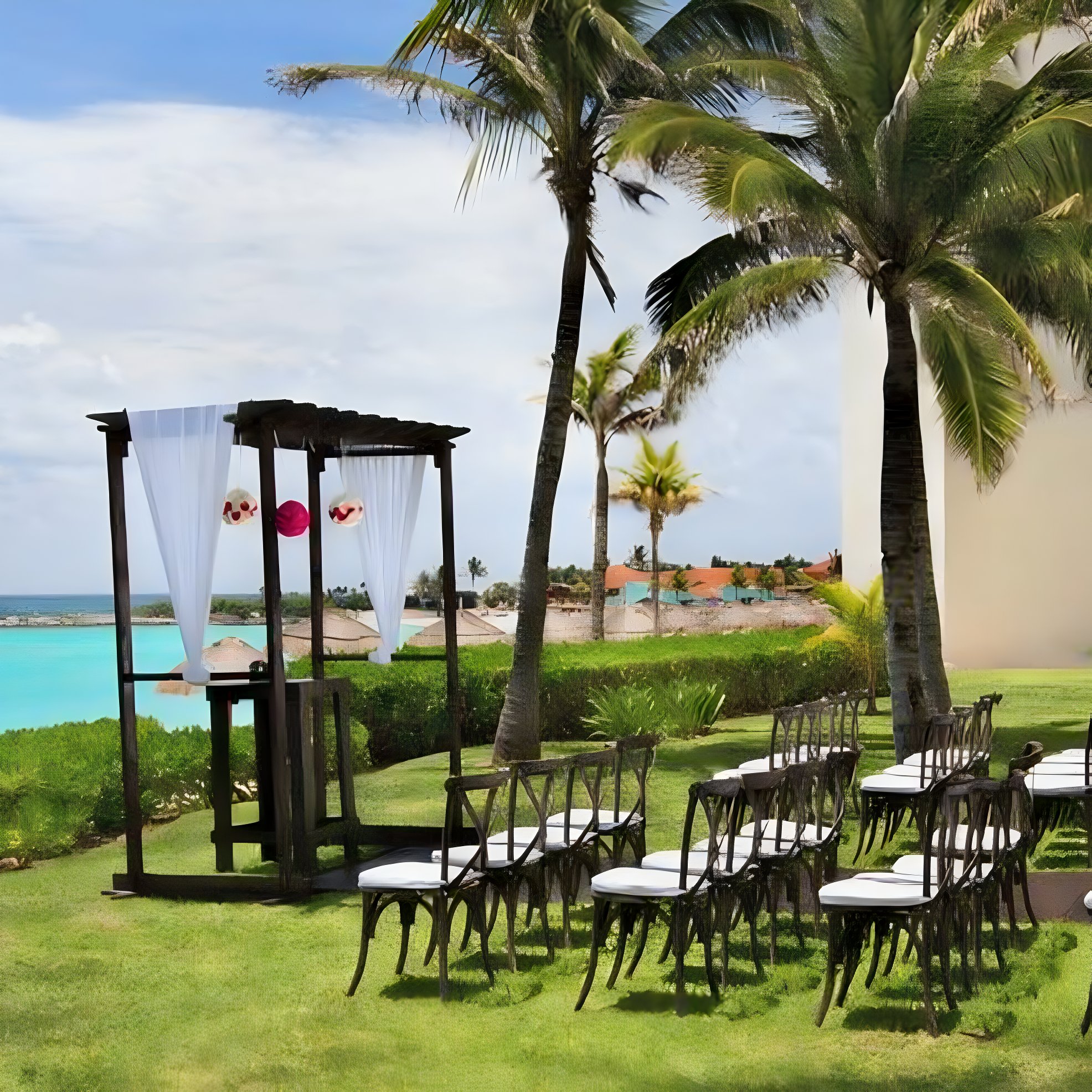Intimate wedding on a lawn with a chuppah at The Westin Cancun Garden