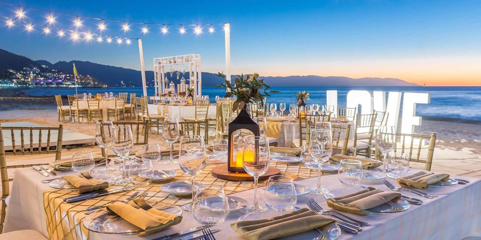 A wedding reception arranged at Buenaventura Grand Hotel & Great Moments on the beach at sunset.