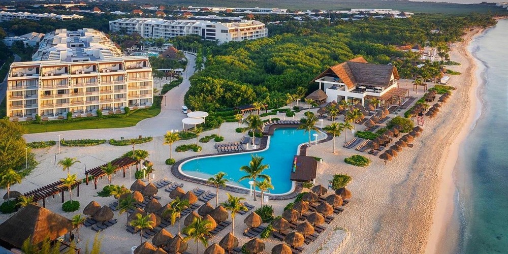An aerial view of Ocean Riviera Paradise Resort and beach, set up for a wedding.