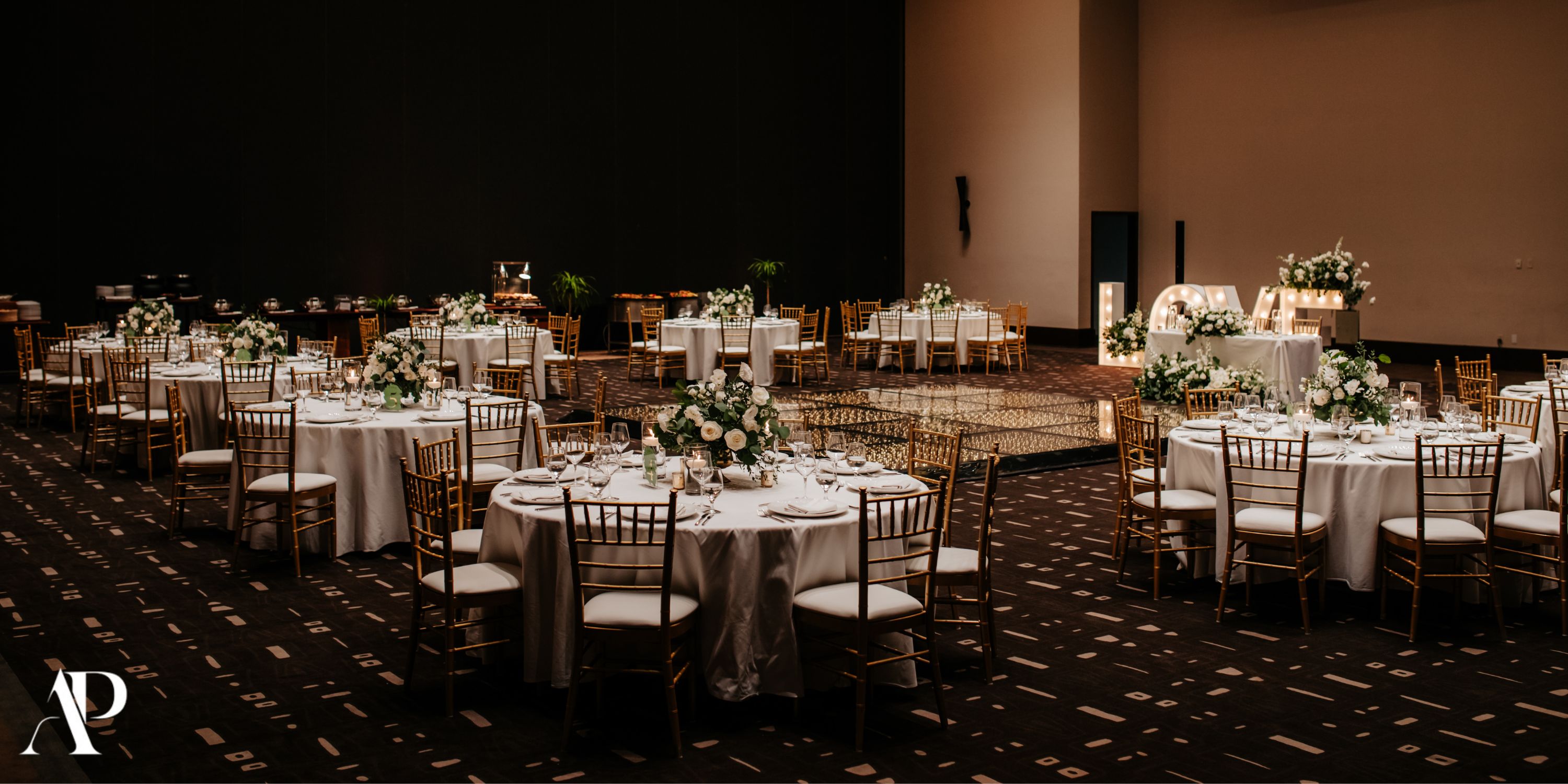 Round tables with white linens and floral decor set for a destination wedding at Secrets Moxche Playa del Carmen.