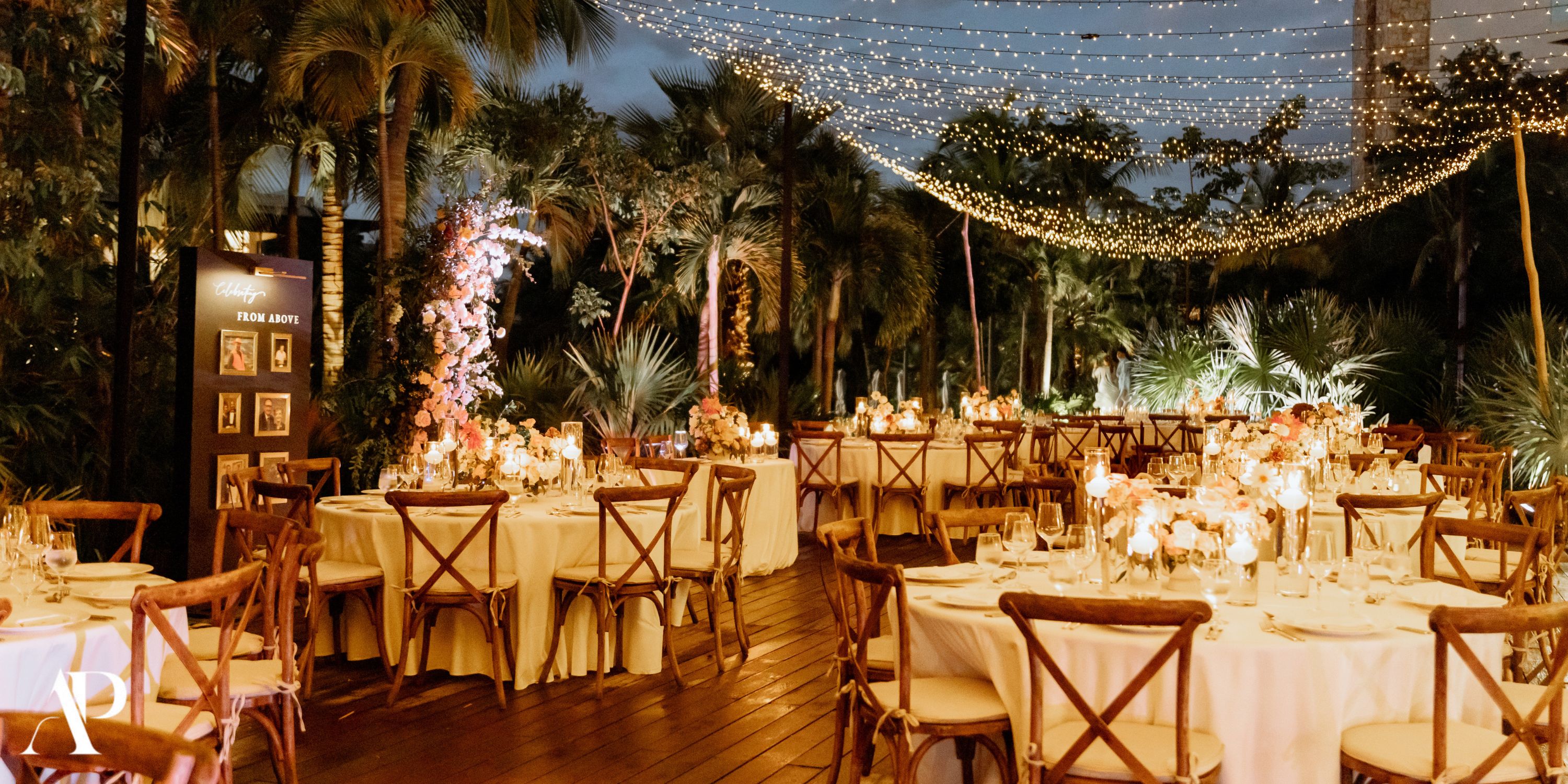 Destination wedding evening at Secrets Moxche Playa del Carmen, round tables and glowing string lights.