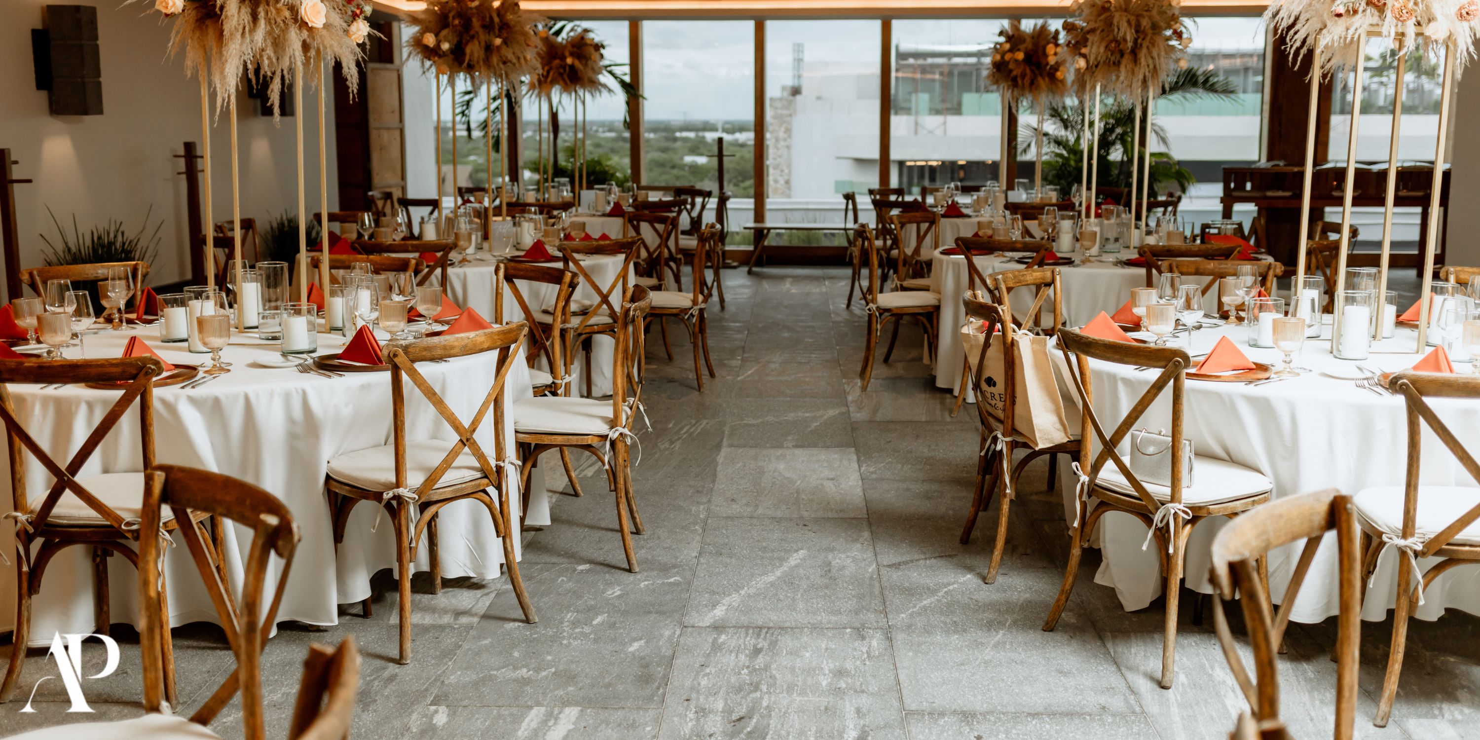Indoor wedding venue at Secrets Moxche Playa del Carmen with round tables and neutral decor, ideal for a destination wedding.