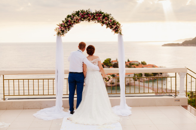 Back-view of a gorgeous couple after their destination wedding in Riviera Maya