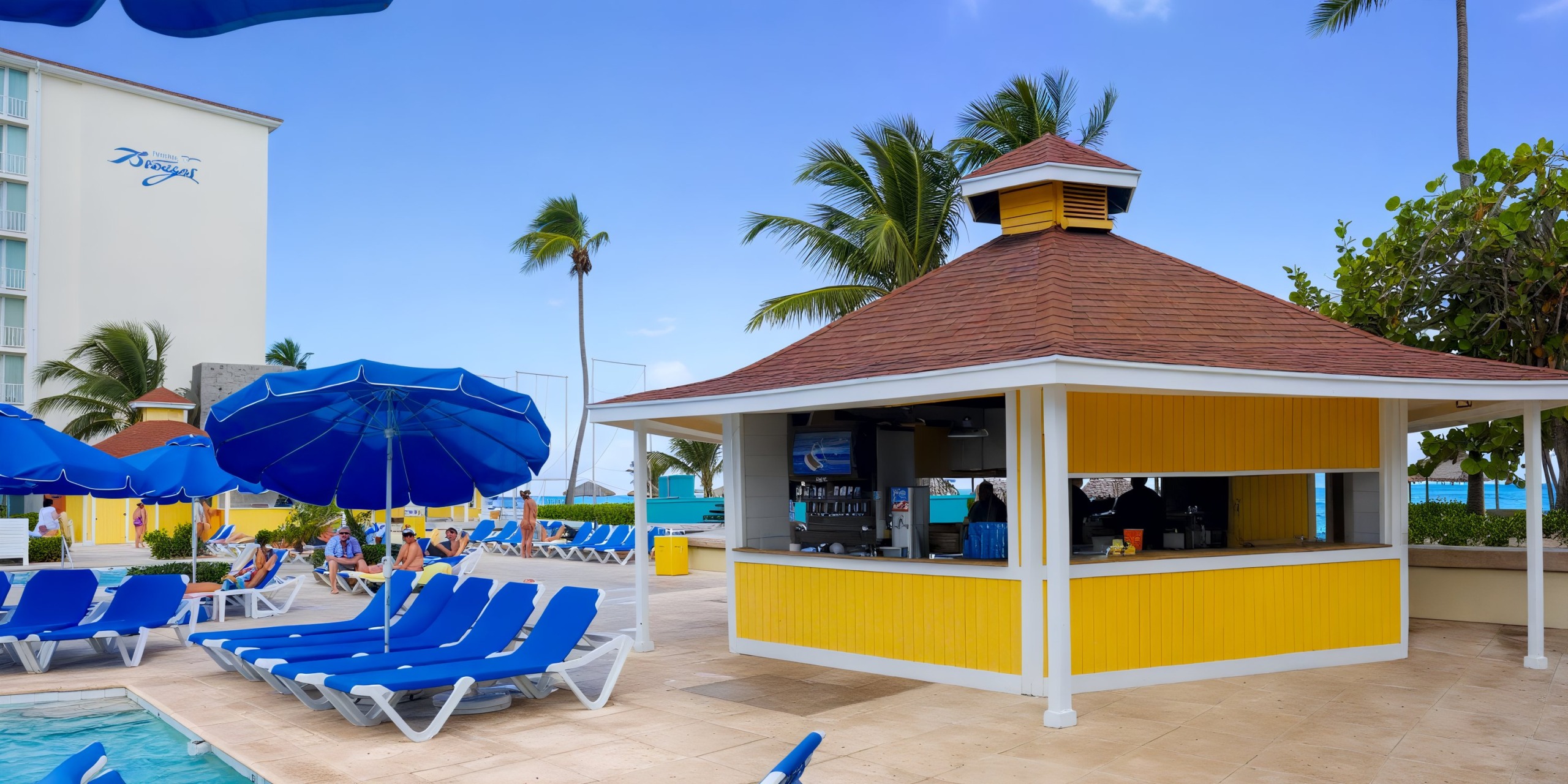 The Breezes Resort Bahamas All Inclusive features a poolside bar with a yellow and white exterior, surrounded by blue lounge chairs. Palm trees and a building provide the background under a clear blue sky.