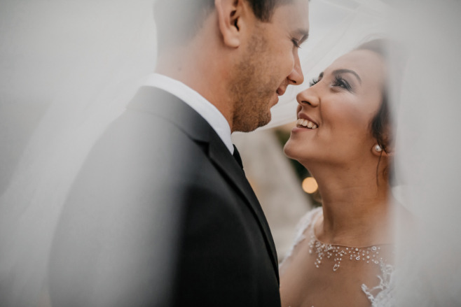 Gorgeous couple swooning on the day of their destination wedding