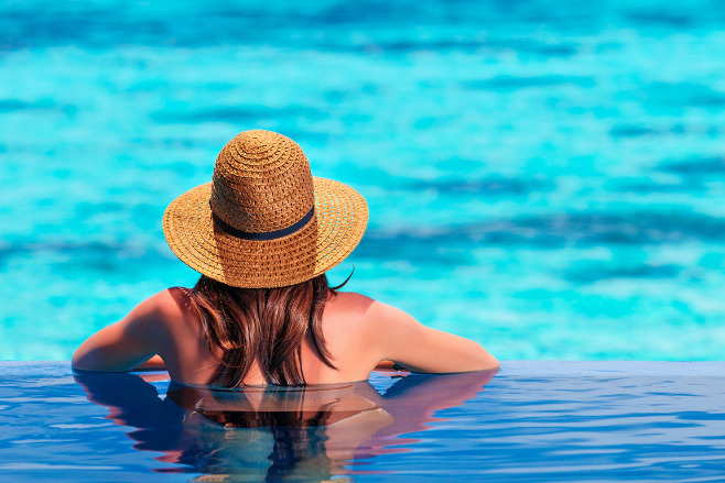 A woman in an infinity pool