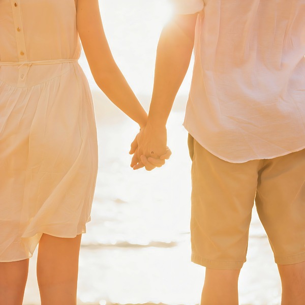 Couple holding their hands after a destination wedding