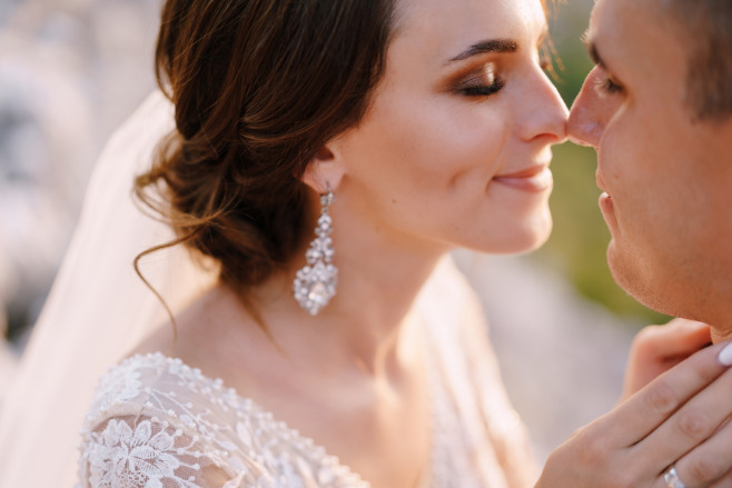 Happy couple smiling during their destination wedding schedule