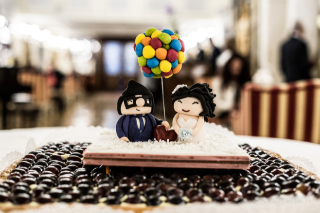 Cute cake with chibi-versions of a bride and groom