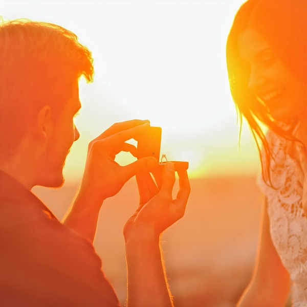 A man proposing to his girlfriend at sunset is a great proposal idea