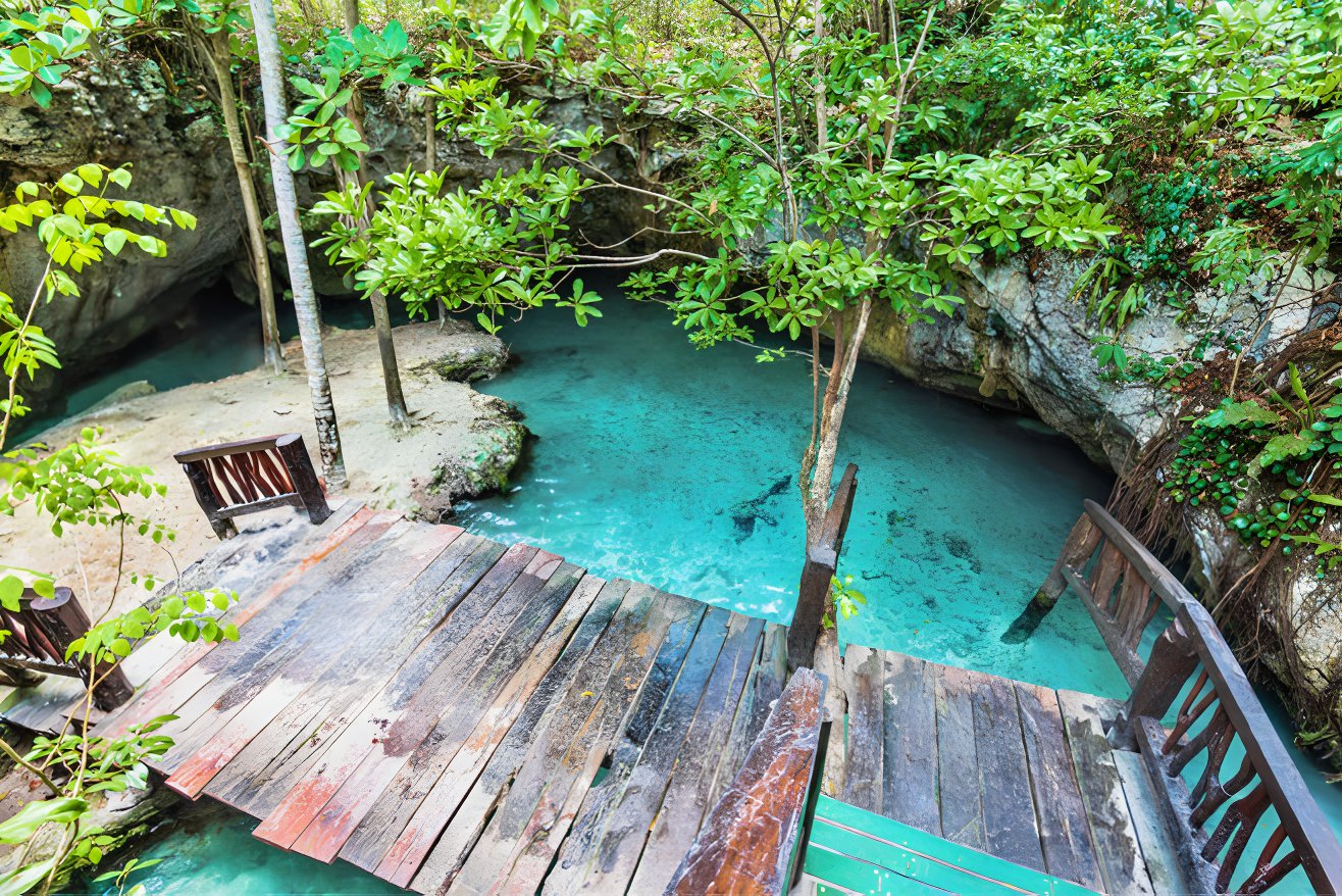 A cenote in Mexico with clear blue water