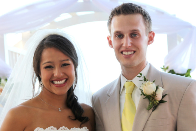 A couple smiles at their destination wedding using a Jamaica wedding package