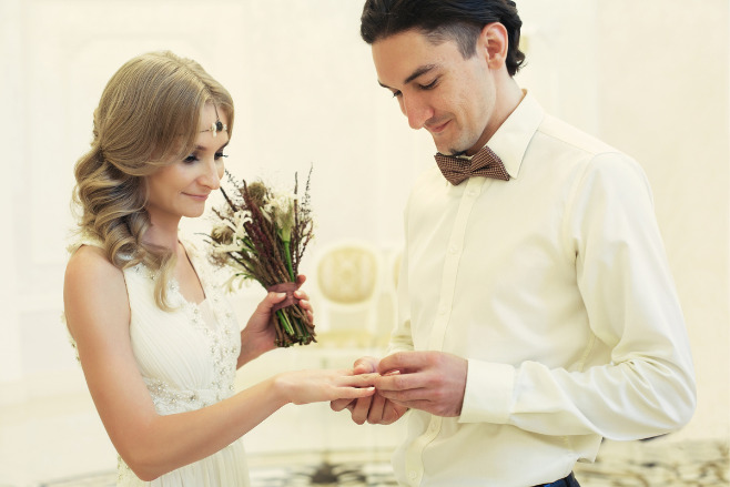 A destination wedding couple saying "I do"