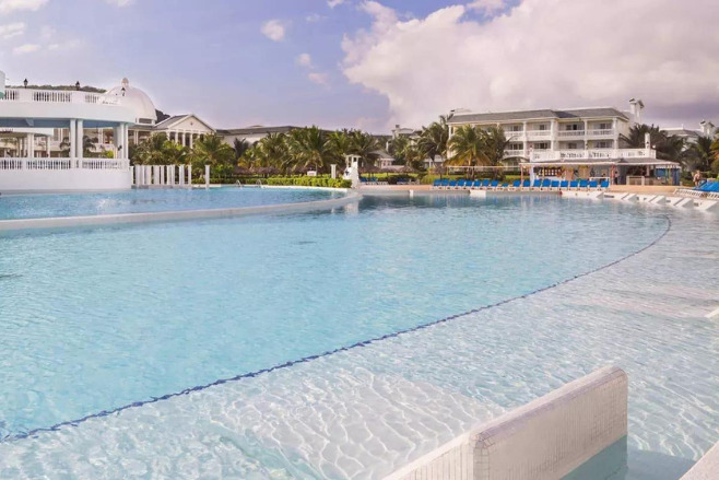 Pool view of all-inclusive Grand Palladium Lady Hamilton offering destination wedding packages for 20 people