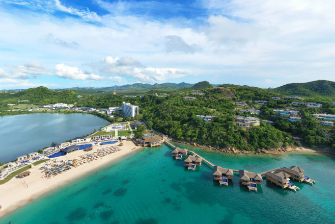 The sea and trees around Royalton Antigua, a destination wedding resort offering Caribbean Islands Wedding Packages Under $5000