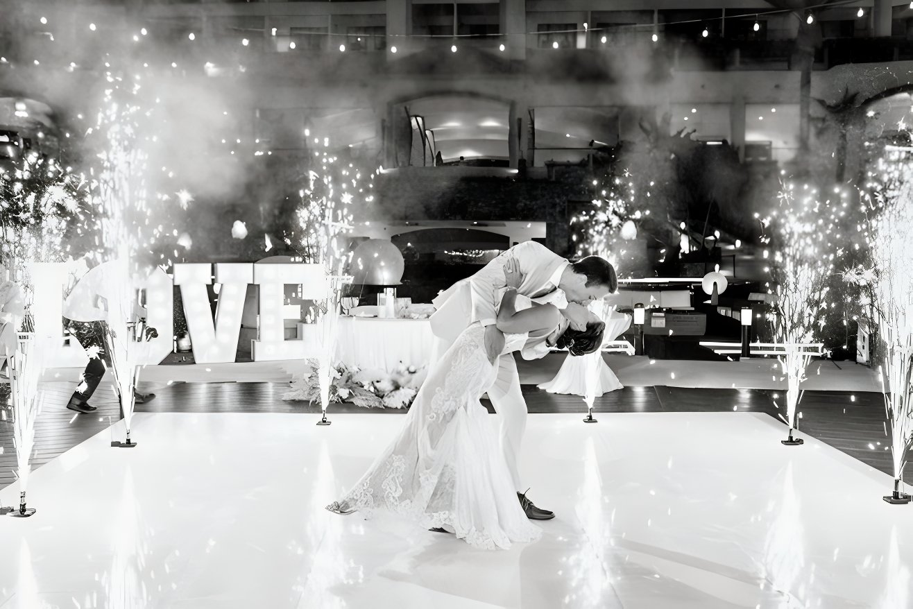 Black and white photo of a couple kissing after their destination wedding