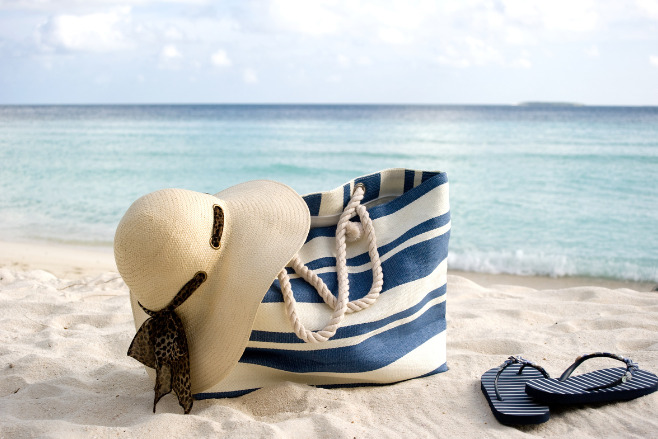 A beach bag on a beach on a sunny day