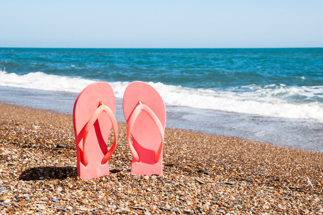 Decorative flip flops on a beach