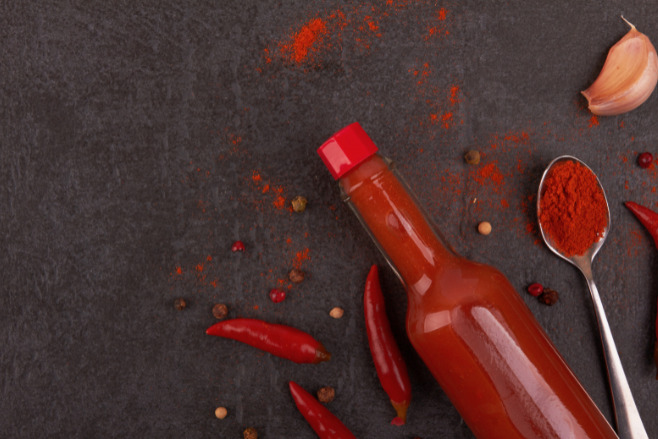 Hot sauce bottle on a table