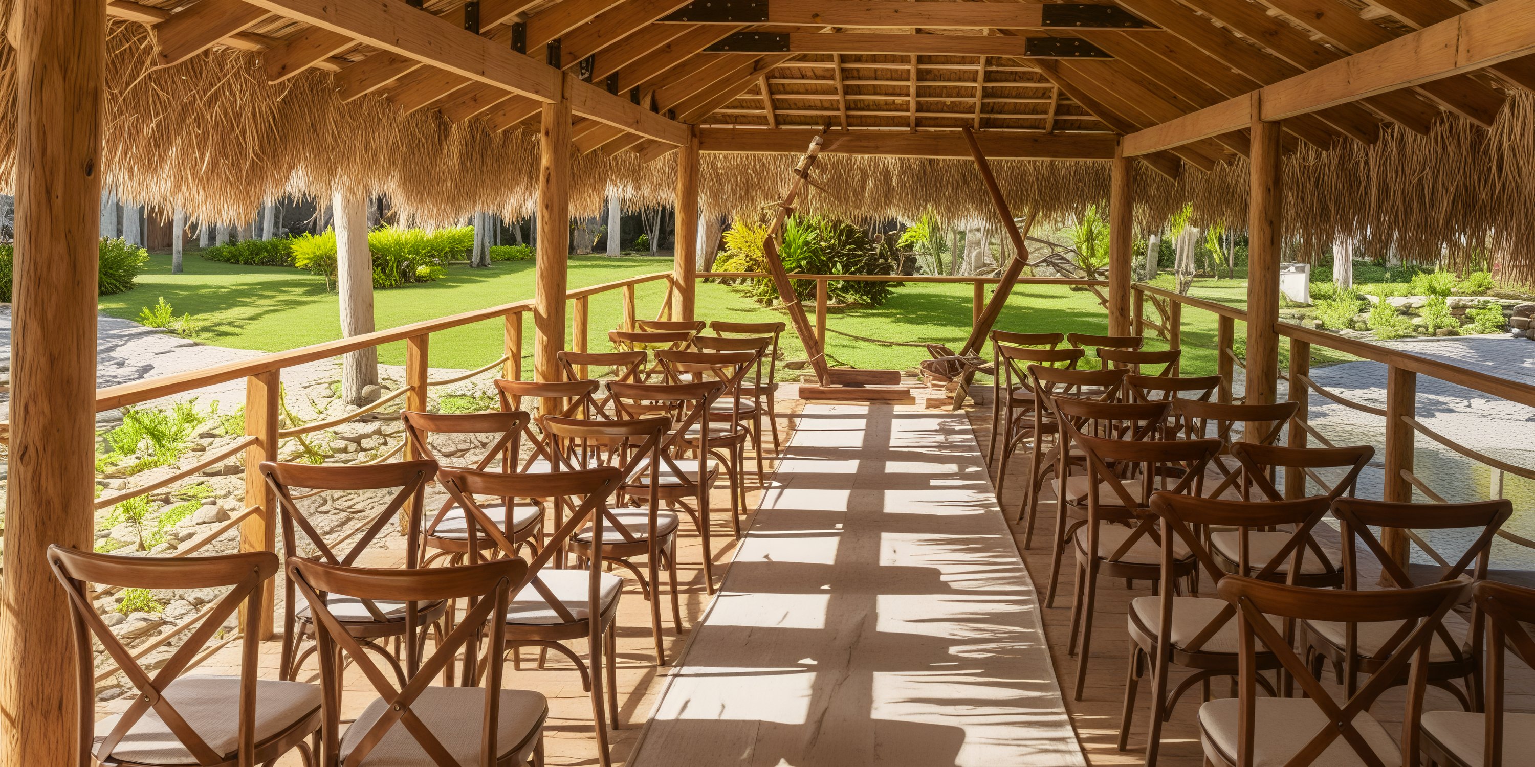 Dreams Flora: A breathtaking destination wedding venue featuring an outdoor chapel adorned with wooden chairs and a charming straw-roofed structure.