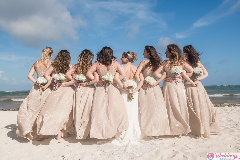 Bride and bridesmaids at the beach